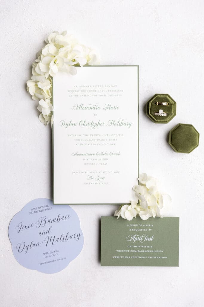a wedding flatlay with green, white & blue 