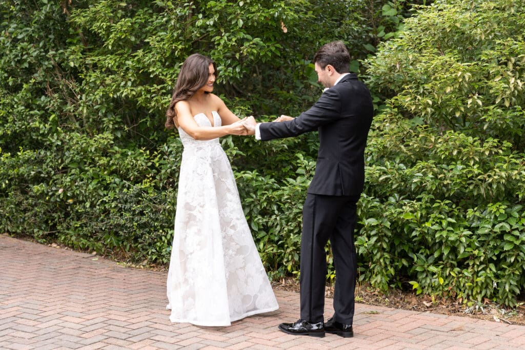 Bride and groom having their first look before their wedding at The Grove Houston.