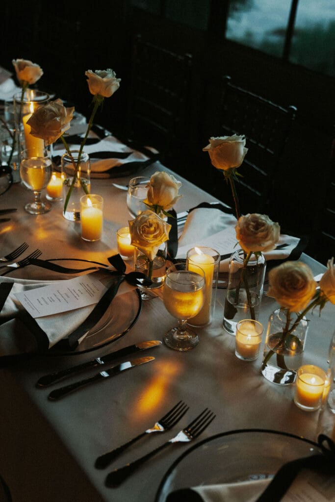 modern-astorian-wedding-custom-menus-black-bows-rose-floral-centerpieces