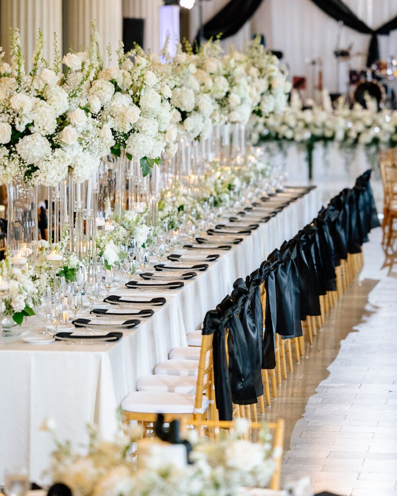 Corinthian-Houston-black-white-wedding-centerpieces-black-bow-wedding-chairs