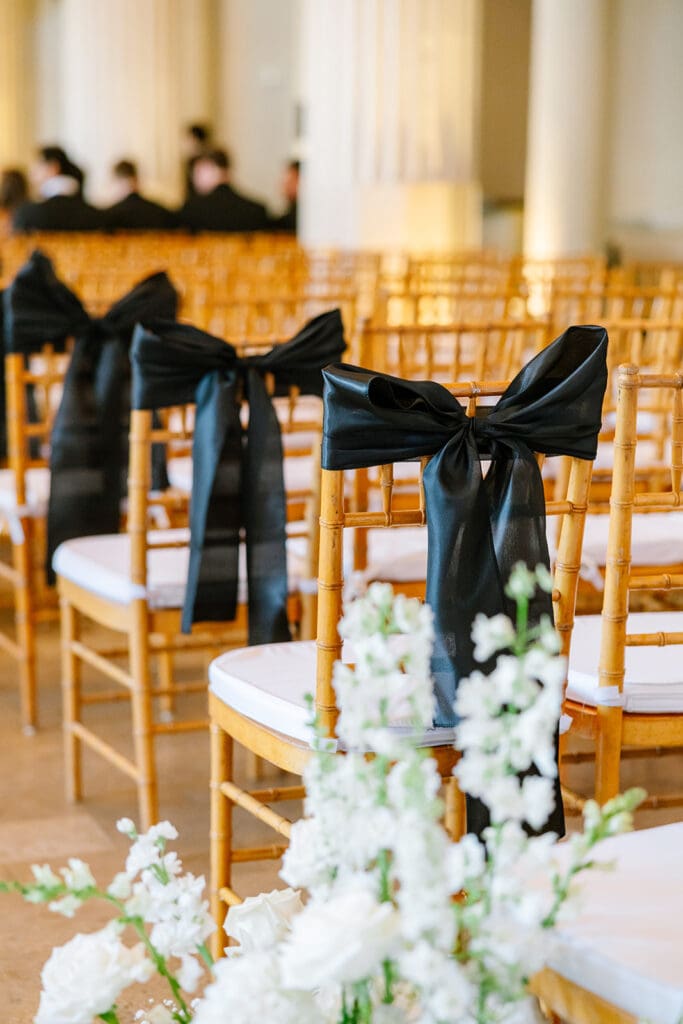 Corinthian-Houston-black-white-wedding-black-bow-wedding-ceremony-chairs